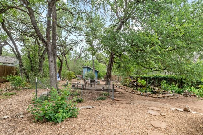 Backing directly to the greenbelt, the backyard feels like an extension of the park itself—quiet, shaded, and full of possibility | Image 25