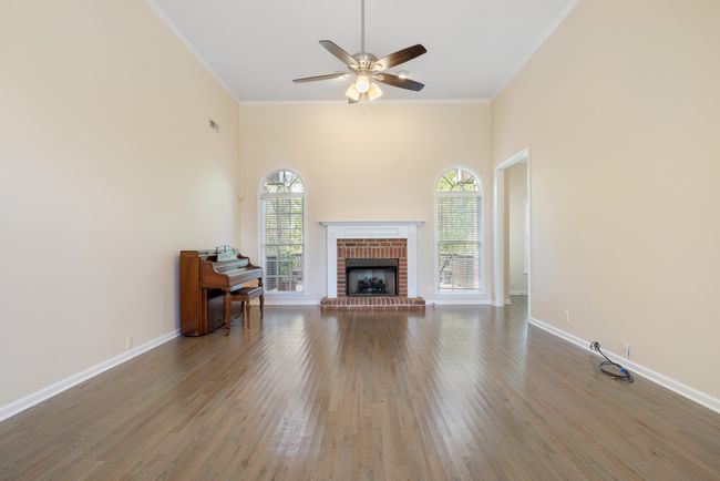 The great room is made cozy with brick fireplace | Image 7