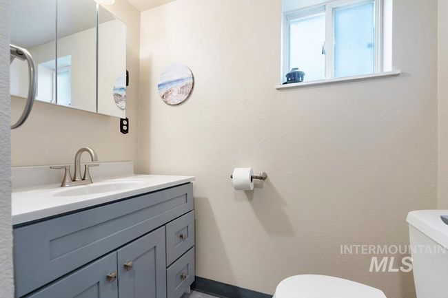 Bathroom with toilet and vanity | Image 19