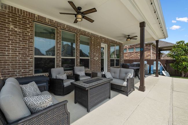 View of patio / terrace with an outdoor hangout area and a ceiling fan with hookups for outdoor kitchen | Image 7