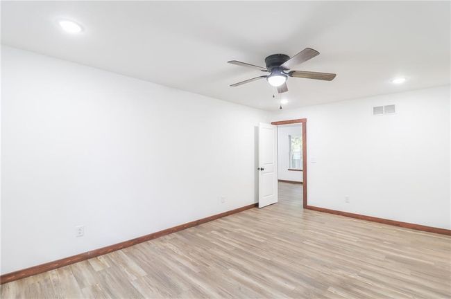 Spare room featuring ceiling fan and light hardwood / wood-style floors | Image 28