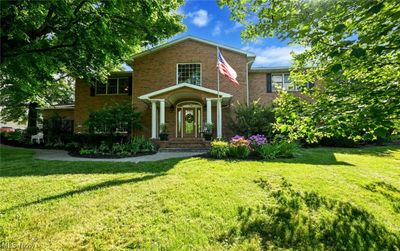 View of front facade with a front yard | Image 1