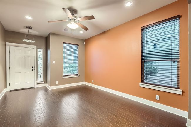 Foyer entrance featuring a ceiling fan, dark wood-type flooring, and recessed lighting | Image 4
