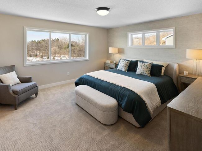 This spacious 14x13 primary bedroom offers a serene retreat, complete with a luxurious en-suite bathroom. Enjoy ample space for relaxation, along with stylish finishes and thoughtful details that make this suite a true sanctuary. | Image 23