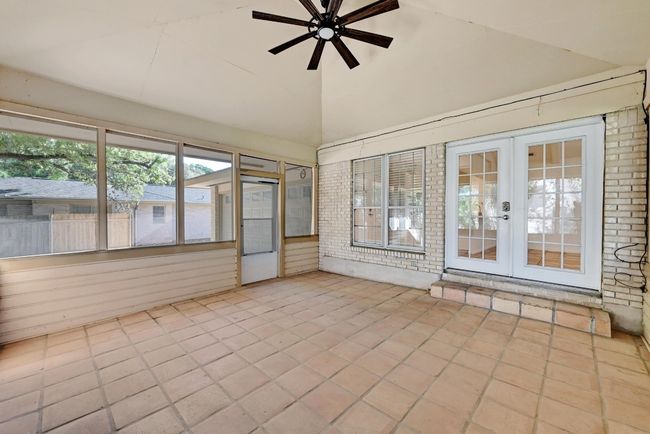 Unfurnished sunroom featuring french doors | Image 25