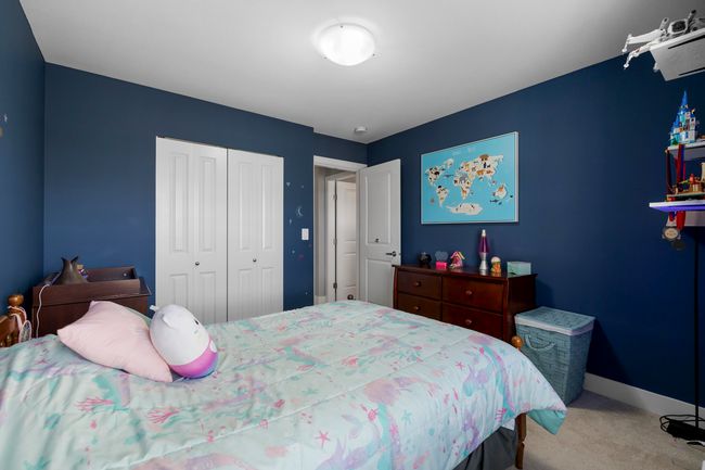 Bedroom featuring a closet, baseboards, and carpet flooring | Image 23