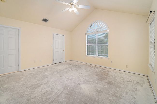 Second Primary Bedroom with ceiling fan, vaulted ceilings, walk in closet. | Image 14