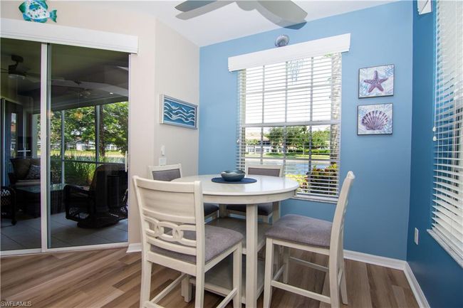 Enjoy a casual meal at the breakfast table in the kitchen. | Image 14