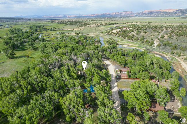 Aerial overview of property's location with a mountainous background | Image 61