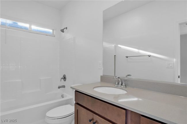 Full bathroom featuring vanity, toilet, and bathtub / shower combination | Image 19