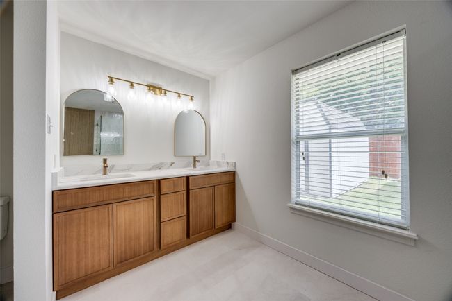 Bathroom featuring double vanity and plenty of natural light | Image 19