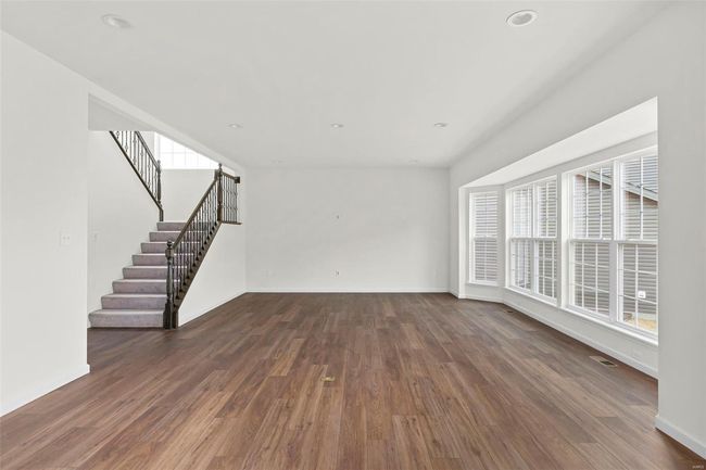 Unfurnished living room with dark hardwood / wood-style flooring | Image 18