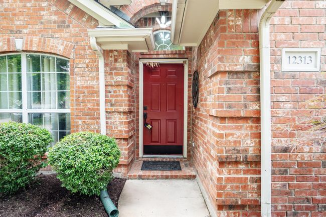 Property entrance with brick siding | Image 4