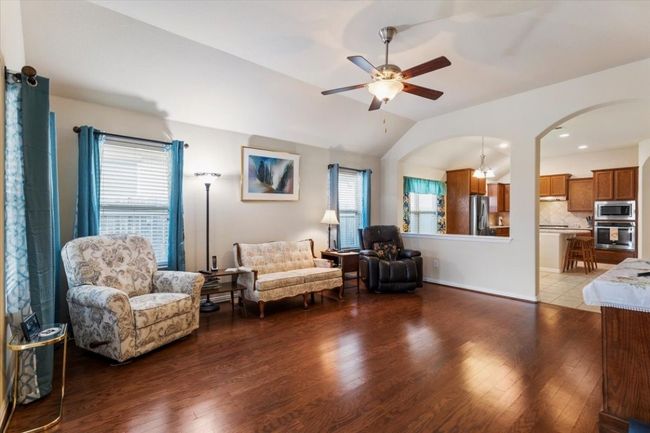 Beautiful hardwood floors make for a warm inviting living room. | Image 18