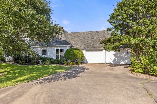 View of side garage featuring long driveway with extra parking | Image 37
