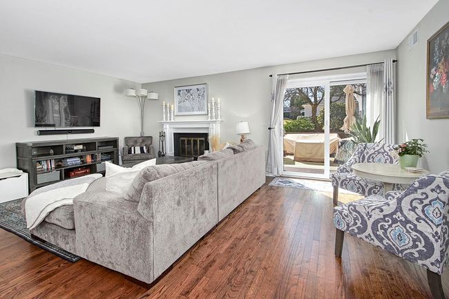 Living area with doors out to spacious deck | Image 7