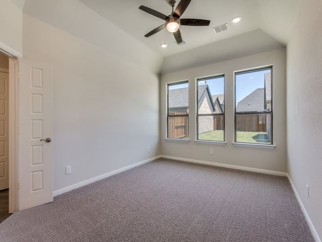 Offering high ceilings, large windows and plush carpeting, this dreamy owner's suite is calling your name! | Image 10