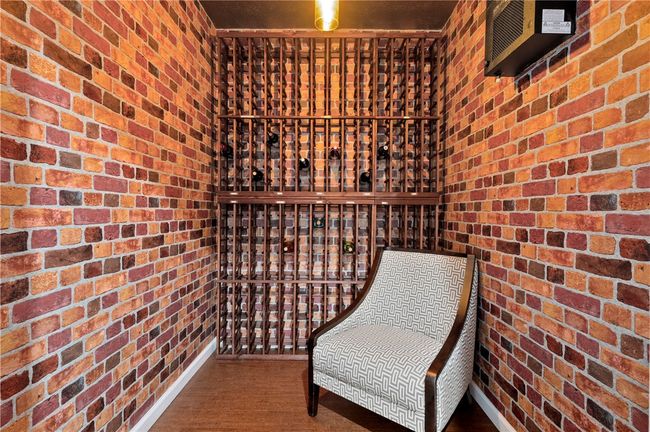 The basement includes a custom temperature/humidity controlled 320 bottle wine cellar. | Image 24