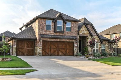 View of front of property with a garage and a front lawn | Image 3