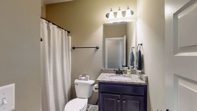 The second bathroom is conveniently located between the two guest bedrooms. | Image 24