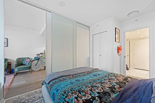 Bedroom with light wood finished floors and a closet | Image 14