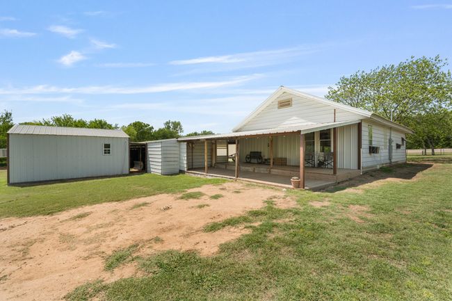 Back of house featuring an outbuilding and a yard | Image 20