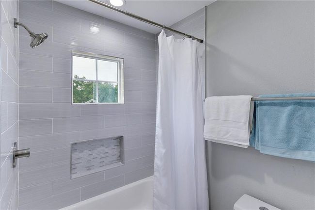 Full bathroom with shower / bath combo and toilet | Image 16
