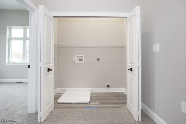 Clothes washing area with electric dryer hookup, washer hookup, and carpet floors | Image 19