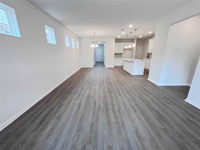 The Robin II- Family Room into Dining. Home under construction, image used for illustrative purposes only, colors and options will vary. | Image 4