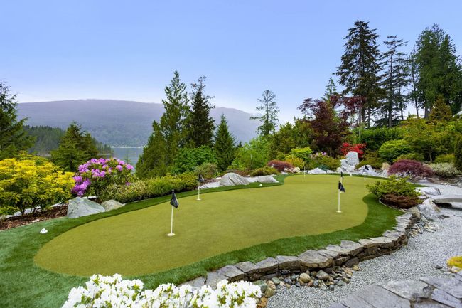Surrounding community featuring a mountain view and a putting area | Image 33