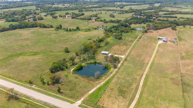 Stocked pond at the front of the property. | Image 22