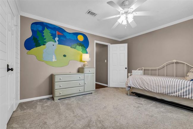 Third bedroom with a shiplap accent wall and custom-painted wall. | Image 32