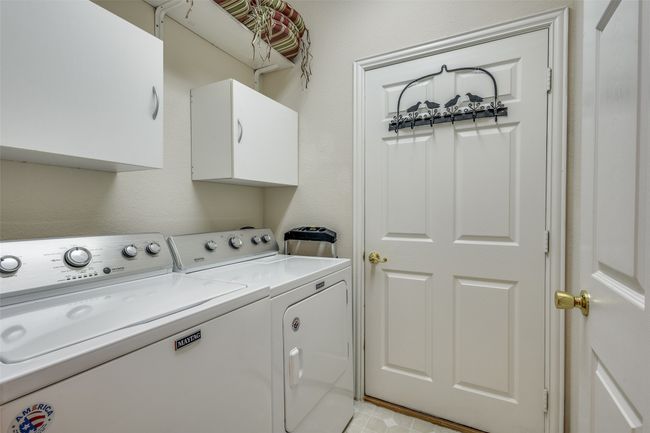 Laundry room with washer and clothes dryer and cabinet space | Image 15