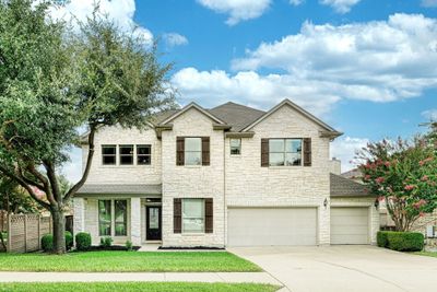 3 car garage with a wide driveway. Workshop available in the garage. | Image 2