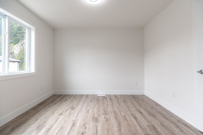 Spare room with plenty of natural light, light wood-type flooring, and baseboards | Image 18