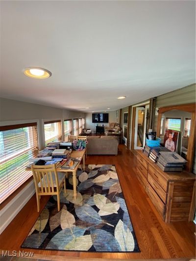 Dining space with hardwood / wood-style flooring and vaulted ceiling | Image 3