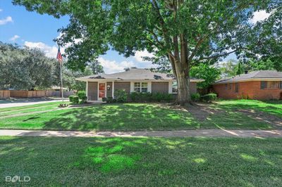 Single story home featuring a front yard | Image 1