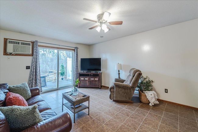 End unit privacy with nice patio space off of the living room | Image 12