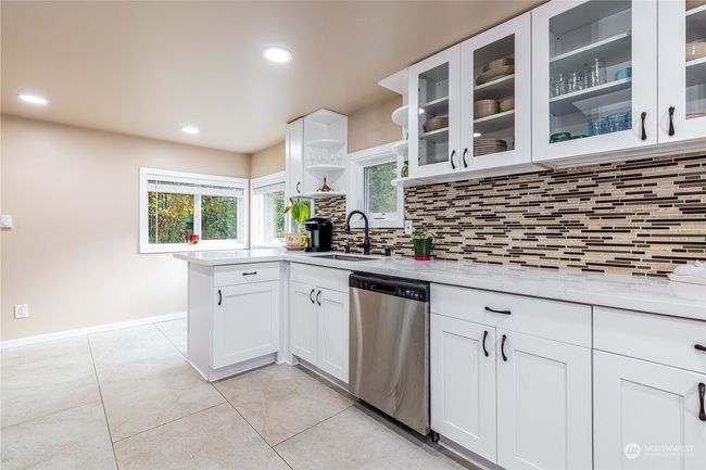 Kitchen with extra eating space. Quartz counters. On main level | Image 11
