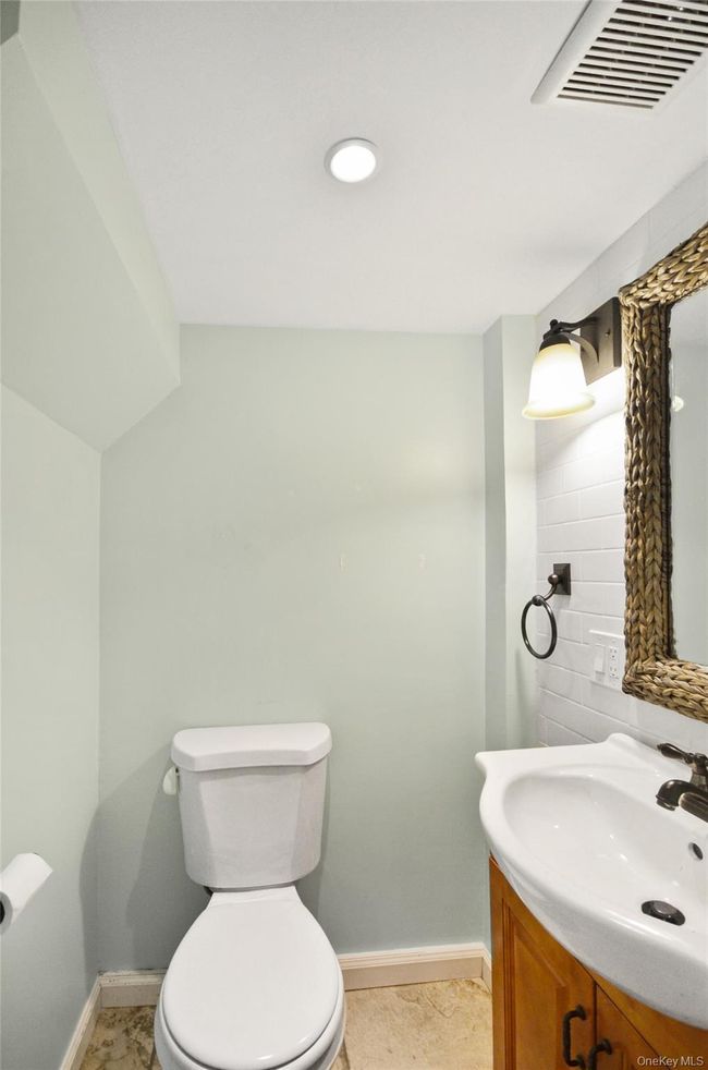 Half bathroom with baseboards and vanity | Image 10