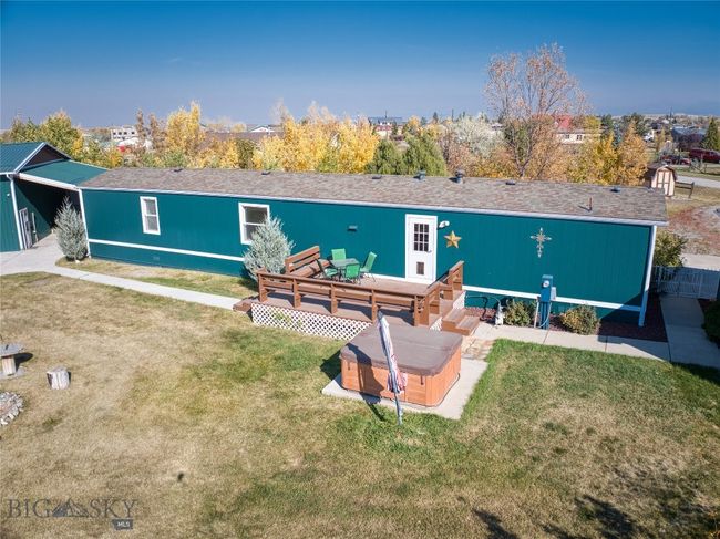 Rear of home showing deck and hot tub | Image 30