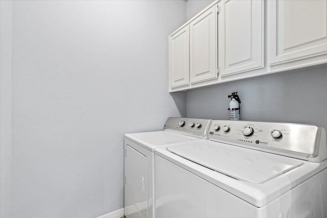 Laundry room with cabinet space and washing machine and clothes dryer | Image 21