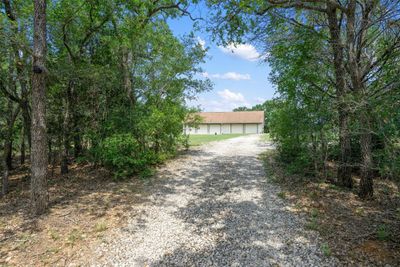 Driveway into property allows you time to take a deep breath and shake off the stress before exiting the real world. | Image 3