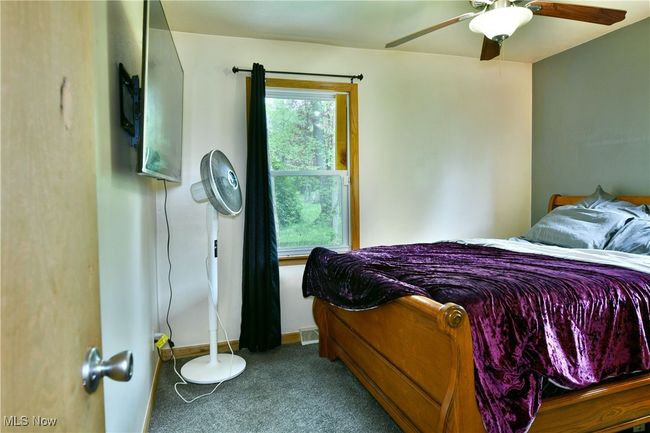 Bedroom with carpet floors and ceiling fan | Image 31