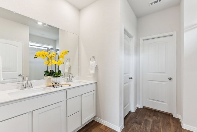 Fresh & Functional: Each bathroom features tasteful updates and modern finishes. | Image 9