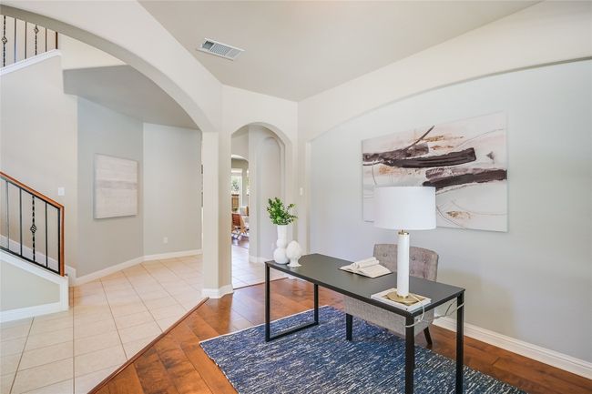 Home office featuring arched walkways and wood-type flooring | Image 19