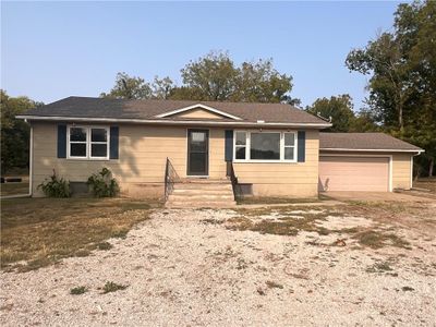 View of front facade featuring a garage | Image 1