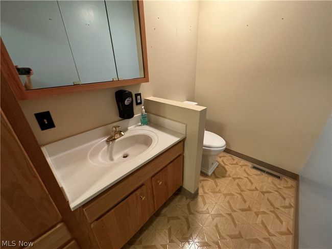 Bathroom with toilet and vanity | Image 15