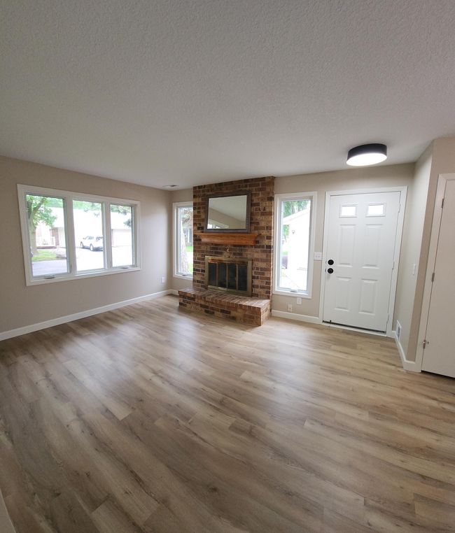 Gas fireplace for the cold Minnesota winters! Tons of natural light shining through! | Image 12