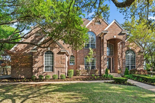 Traditional-style home with four sides brick - beautiful landscaping. | Image 39